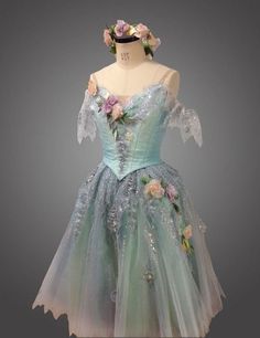 a dress made out of tulle with flowers on it