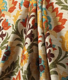 an orange, yellow and green floral print fabric