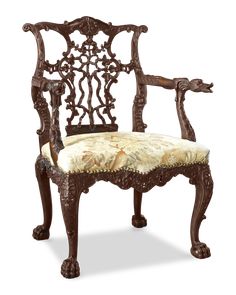 an old fashioned chair with sheep fur on it's back and armrests