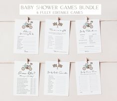 the baby shower games bundle is hanging from clothes pins