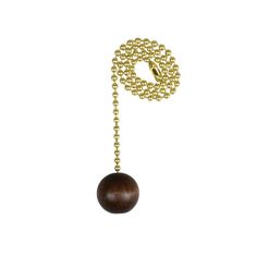 a ball and chain on a white background with a gold colored bead necklace hanging from it's end