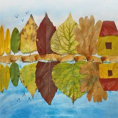 an art project with leaves and houses on the water