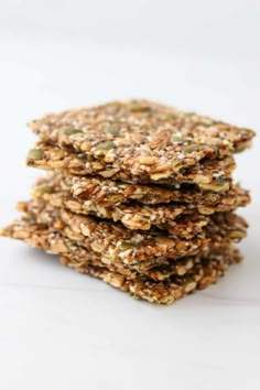 a stack of granola cookies with text overlay reading gluten - free seed crackers