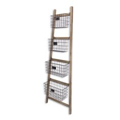 a wooden ladder shelf with baskets on it