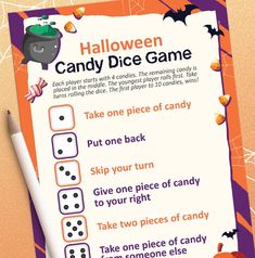 a halloween candy dice game is shown on the table