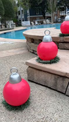 some red and silver ornaments near a swimming pool