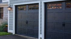 two garage doors are open in front of a house