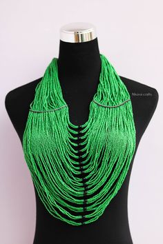 African beaded necklaces, Beaded necklaces for women, African women jewelry, Beaded fringe necklace, Christmas gift for her, Moms gift An elegant necklace that can compliments any outfit. Handmade by the Maasai women in Kenya using fine beads. One size fits all. Color: Green Necklace length: 17 inches 3-5 days delivery via DHL Express. Pay shipping fee for the first item only and additional items ship for FREE. To view more items in our shop, kindly click here: https://www.etsy.com/shop/NkoroiCr Green Round Beads Bib Necklace As Gift, Green Bib Necklace With Round Beads For Gift, Necklaces Beaded, Necklace Snake, North Star Necklace, Face Jewellery, Fringe Necklace, Christmas Gift For Her, Necklace Necklace