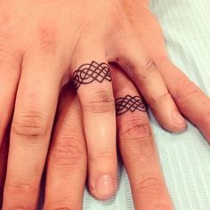 two people with matching rings on their fingers