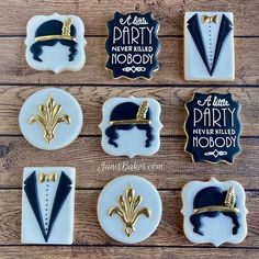 decorated cookies with black and gold designs on them for a new year's eve party