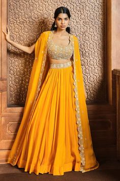 Buy Yellow Soft Organza Embroidery Sequin Scoop Neck Placement Cape Lehenga Set For Women by Aneesh Agarwaal Online at Aza Fashions. Yellow Bridal Haldi Outfit, Wedding Guest Haldi Outfit, Haldi Outfit For Guest Women, Lehenga Designs Haldi, Lehenga Designs For Haldi Function, Women Haldi Outfit, Cape Style Dresses Indian, Designer Haldi Outfit For Women, Haldi Ceremony Outfit Indian