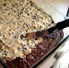 a cake in a pan with a knife on top