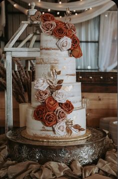 a three tiered cake with flowers on it