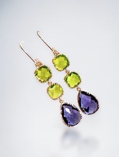 Peridot Earrings - Peridot Gold Dangle Earrings, bridesmaid gifts, Wedding Earrings, August Birthstone earrings, Birthday Gift  This stunning jewelry set is the perfect gift for any special occasion! These beautiful handmade earrings are the perfect addition to any jewelry collection. The combination of peridot and amethyst creates a stunning green and purple color scheme that will complement any outfit. Eye-catching design featuring natural peridot and amethyst gemstones. Made with high-quality Green Briolette Earrings For Wedding, Briolette Gemstone Earrings For Wedding, Purple Briolette Earrings For Wedding, Green Crystal Wedding Earrings With Ear Wire, Green Drop Earrings For Bridesmaid Gift, Elegant Green Bridal Earrings For Bridesmaids, Peridot Earrings, Amethyst Gold, Birthstone Earrings