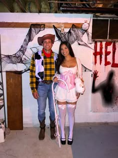 a man and woman dressed up in costumes