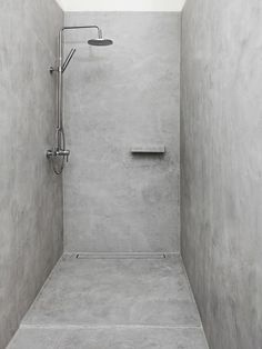 a walk in shower sitting inside of a bathroom