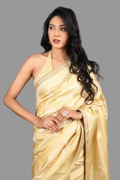 Gold banarasi handloom saree crafted in pure silk with bahar vine striped woven details. Comes with an unstitched blouse piece. - Aza Fashions Saree Gowns, Dhoti Saree, Cotton Sarees Handloom, Handloom Silk Saree, Ruffle Saree, Drape Saree, Lehenga Saree, Buy Gold, Banarasi Sarees