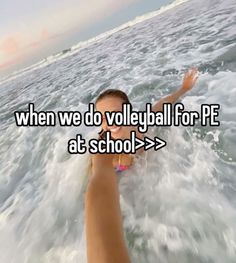 someone is swimming in the ocean with their arms out and texting, when we do volleyball for pe at school > >