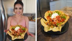 a woman holding up a taco in her hand