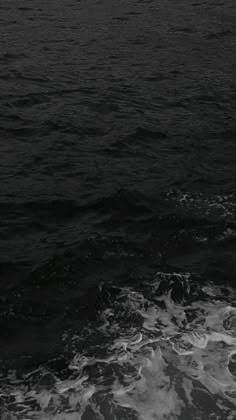 a black and white photo of the ocean