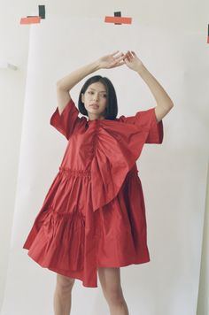 The Farfalle Babydoll Dress is a bold trapeze-cut dress in rich silk taffeta. A gathered silk panel on the bodice can be worn as a sculptural detail or a romantic cascading neckline. Raw edge ruffled seams, a dance-everywhere dressed up/down silhouette, finished with a delicate front pocket for stashing after-dinner mints. Loose billowing fit. Keyhole back closure. Pre-order only, ships late Summer 2022. Voluminous A-line Dress With Ruffles, A-line Taffeta Dress With Ruffles, Silk Dresses With Ruffles And Voluminous Skirt, Silk Dress With Voluminous Gathered Skirt, Spring Voluminous Dress With Ruched Bodice, Summer Dresses With Voluminous Ruffle Hem, Voluminous Spring Dress With Ruched Bodice, Silk A-line Dress With Voluminous Skirt, Chic Dress With Ruched Bodice And Voluminous Fit