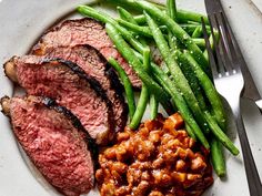 steak, beans and green beans on a plate