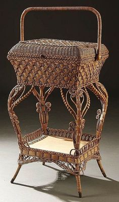 an antique wicker basket with handles and seat