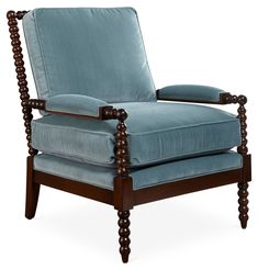 a blue chair with wooden legs and arms