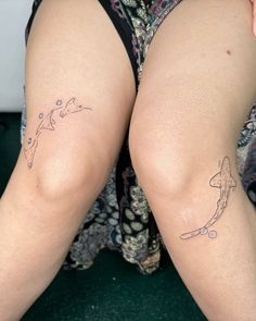 the legs of a woman with tattoos on them