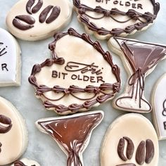 some decorated cookies are sitting on a table