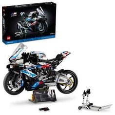 a lego motorcycle is shown in front of a box with the model on it's side