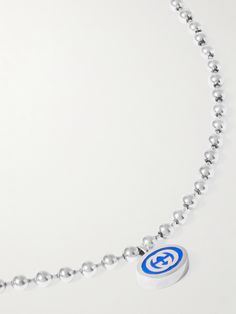 Perfect for illustrating where your brand loyalty lies, Gucci's necklace features a colourful enamel pendant detailed with an 'GG' logo. It's suspended from a silver ball-bead chain, which draws on military styles. Gucci White Gold Pendant Necklace, Gucci Silver Necklace As Gift, Gucci Silver Necklace For Gift, Silver Gucci Necklace As Gift, Silver Gucci Necklace For Gift, Gucci Silver Pendant Jewelry, Gucci Silver Sterling Silver Necklace, Gucci Sterling Silver Necklace, Luxury Sterling Silver Jewelry With Logo