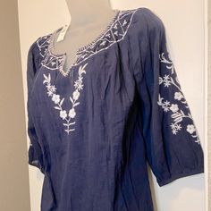 Talbots Embroidered Cotton Blouse Navy Blue With White Embroidery Size Small Petite Three Quarter Sleeves With Elastic V Neck Style Light Weight Gauzy Cotton Fabric New With Tags! Bundle With Other Listings To Save! Blue Cotton Peasant Top With Floral Embroidery, Casual Blue Peasant Top With Floral Embroidery, Casual Blue Embroidered Peasant Top, Summer Blue Embroidered Top With Chikankari, Summer Blue Chikankari Embroidered Top, Blue Chikankari Embroidered Top For Summer, Blue Embroidered Top With Embroidered Sleeves For Summer, Blue Embroidered Short Sleeve Peasant Top, Blue Peasant Top With Floral Embroidery For Spring