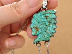 Rare find beautiful hand carved Royston turquoise Chief head pendant with feather charms under. Pendant is in great condition with no visible damages and backside is marked R C for Navajo artist Rose Castillo. Only one is available. Measurement, Pendant measures 3.1 inch (78mm) total in length including top bail, Carved stone measures about 1.15 inch (29mm) by 1.05 inch (26mm) with bezel setting. Pendant weights 11.9 grams total in weight not including chain. Pendant hangs on 18 inch long new st Bohemian Carved Sterling Silver Jewelry, Collectible Engraved Bohemian Turquoise Necklace, Turquoise Carved Bohemian Jewelry, Bohemian Carved Turquoise Jewelry, Bohemian Turquoise Carved Jewelry, Insect Ring, Dragonfly Ring, Indian Chief, Carved Stone