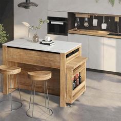 a kitchen with an island and two stools