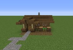 a small log cabin sitting on top of a grass covered field