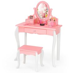 a pink vanity table with a mirror, stool and makeup bag on it's side