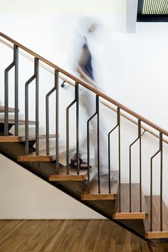 a blurry image of a person walking down the stairs