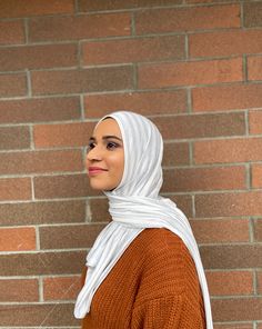 A perfect hijab for year round wear! Super icy cool tones for winter and also the perfect feel for spring and summer. Premium jersey hijab made in limited edition prints. Available in two hijab styles! Fabric content: Viscose and spandex. Woven yarn dyed. Color: Eggshell white and light blue-ish heathered grey stripes. Pattern placement may vary. Feel: Light weight and silky feeling. Requires an under cap. Semi transparent due to the color. Available styles: Slip-on or regular wrap style. Measur Eggshell White, Jersey Hijab, Hijab Styles, White Slip, Sewing Studio, Semi Transparent, Cool Tones, Limited Edition Prints, Yarn Dyeing