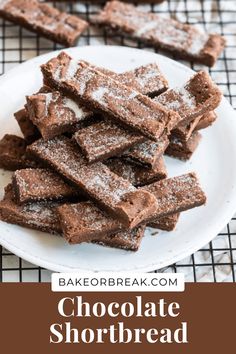 chocolate shortbreads on a plate with powdered sugar over them and the words, chocolate shortbread