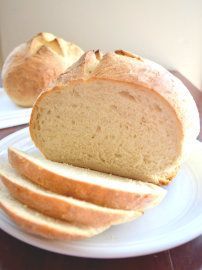 a loaf of bread on a plate with the words easy sourdough bread over it