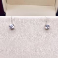 Elegant Diamond Solitaire Children's Ear Studs made with Natural Diamonds Available in 18K Yellow Gold & White Gold  Please confirm at the time of order Hypoallergenic Stud Earring's safe for children to wear.  Total Head Dimensions: 3.0mm x 3.0mm Gauge of the post: 18g - 20g = 0.8mm - 1mm Toal Number of Diamonds : 02 Diamond Weight: 0.24 carats (0.12 cts Each)   Metal : 18K (750) White Gold  Gold Weight : 0.50gm  Fastening: Screw Back/Flat back (Screw Back with safety tube which protects from sharp edges)  Packaging : Elegant Box  Shipping Free in UK Shipping World Wide : See Policy Returns Policy : 14 Days Hassle Free Returns To View this item you are welcome to visit our North West London Showroom Round Diamond Earrings With Single Cut Diamonds, Sterling Silver Diamond Earrings With Single Cut, Diamond White Earrings With Prong Setting As Gift, Anniversary Round Single Cut Diamond Earrings, Formal Diamond White Earrings With Single Diamond, Formal Drop Earrings With Single Diamond, Sterling Silver Single Diamond Round-cut Earrings, Lab Grown Diamond Earrings In Diamond White, Sterling Silver Earrings With Single Round-cut Diamond