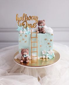 there is a cake that has been decorated to look like a baby's first birthday