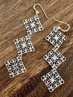 These sterling silver earrings are delicate, simple, and stunning. They are the perfect accent piece and can be worn as a daily favorite or dressed up for a night out.  There are three diamond shaped sterling silver filigree pieces each measuring approximately 3/4" W x 3/4" L and are linked together to create a classic and elegant look. They are lightweight and feature a French wire for comfortable wearing. The length of drop from bottom of hook is 2.5".  They are in excellent condition. Thank y Diamond-shaped Pierced Jewelry Gift, Nickel Free Silver Diamond-shaped Jewelry, Silver Sterling Diamond-shaped Jewelry, Elegant Sterling Silver Diamond-shaped Jewelry, Sterling Silver Filigree Chandelier Earrings, Gift Sterling Silver Diamond-shaped Earrings, Sterling Silver White Gold Chandelier Earrings, White Gold Sterling Silver Pierced Chandelier Earrings, White Gold Sterling Silver Diamond-shaped Earrings