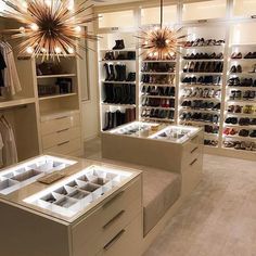 a large walk in closet filled with lots of shoes