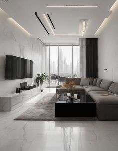 a modern living room with white walls and marble flooring, large sectional couches