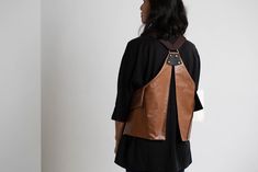 "Unique Faux Leather Backpack, Vest Backpack, Vegan Backpack, Bike Backpack, Brown Backpack Women, Backpack For Women For The Urban Life Carries all your daily belongings. This urban backpack is easy for travel in the city. This backpack was carefully designed after much thought, for my own comfort living the busy city life, riding my bicycle, and running. A combination of good design, comfort, and functionality It is designed like a vest with big pockets to hold the cellphone, wallet, keys, and Brown Backpack, Urban Backpack, Biking Backpack, Brown Backpacks, Faux Leather Backpack, Backpack For Women, Busy City, Open Hoop Earrings, Demi Moore