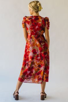 The Fannon Floral Midi Dress in Red Multi is sure to turn heads with its vibrant colors and playful floral pattern. With a comfortable and flattering midi length, this dress is perfect for any occasion. Bring a touch of whimsy to your wardrobe with this one-of-a-kind dress. Details self/lining: 100% polyester Fabric Care Guide Here Sizing & Fit Measurements are approximate and taken while laying flat across the front. Not doubled. small: bust = 18"; length = 48" medium: bust = 19"; length = 48.5 Red Floral Dress For Spring Party, Red Floral Spring Party Dress, Red Flowy Maxi Dress With Floral Print, Party Floral Print Maxi Dress, Red Floral Print Maxi Dress For Garden Party, Red Floral Print Maxi Dress For Brunch, Red Floral Print Midi Dress For Party, Red Floral Print Knee-length Dress, Fitted Red Floral Dress For Spring