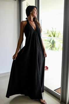 Experience elegance and allure with our Halter Dress Style Backless Maxi. This stunning dress features a captivating V-neckline in the front, complemented by a graceful halter style that accentuates your shoulders and back. The skirt flows beautifully, reaching down to create a long and full silhouette that exudes femininity. Crafted with meticulous attention to detail, this dress comes with a short underdress made of the same fabric, ensuring that you feel confident and comfortable without any unwanted transparencies. The halter straps are designed to be both stylish and supportive, featuring double fabric for added durability. We take pride in using high-quality, eco-friendly materials for our handmade creations. This exquisite dress is exclusively made with a blend of 50% cotton and 50% Chic V-neck Dress For Beach Wedding, Backless Tie-back Halter Dress For Beach, Backless Halter Dress With Tie Back For Beach, Elegant Halter Neck Top For Beach, Elegant Beach Halter Top, Backless Halter Neck Sundress For Beach, Elegant Backless Halter Top For Beach Season, Elegant Halter Neck Backless Dress For Beach Season, Elegant Halter Neck Beach Dress For Party