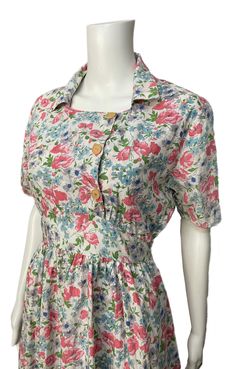 "This is a pretty dress dating from the 1940's. It has a lovely floral print, buttons on the front and side ties. The CC41 label is visible on the neckline, though part of it is missing.  It's in good overall condition. There is a small repair on the front hemline and a small area of colour run from button thread on the front. The cotton is quite crisp and it's possibly been starched at some point)  It's a lovely example from this period with a very pretty print. Bust 36\" Waist 28\" Length from Classic Vintage Dress, Pin Up Princess, Marble City, Colour Run, 1940s Woman, Period Clothing, Floral Pattern Dress, Old Fashion Dresses, Period Outfit